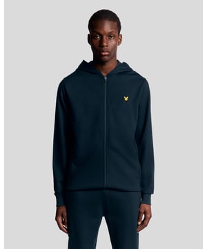 Ein vielseitiger Kapuzenpullover mit Reißverschluss für Komfort und Atmungsaktivität. Aus leichtem Stoff und mit normaler Passform gefertigt, eignet er sich ideal zum Tragen übereinander beim Training oder an entspannten Tagen. - Leichter Stoff für Atmungsaktivität - Normale Passform für mehr Bewegungsfreiheit - Durchgehender Reißverschluss vorne für verstellbaren Schutz - Weiches Tragegefühl für ganztägigen Komfort - Verstellbare Kapuze mit Kordelzug und gerippte Abschlüsse