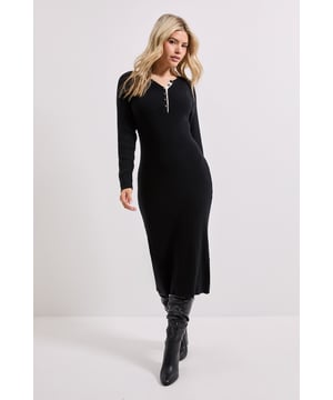 Stylish Henley crew neckline with contrasting button detail for a subtle statement
        Flattering midi length hitting mid-calf for versatile styling options
        Ribbed knitted texture offering comfortable stretch and shape retention
        Long sleeves providing warmth and coverage for transitional weather
        Figure-skimming silhouette that contours without clinging
    
    This Dorothy Perkins Henley Crew Knitted Midi Dress combines comfort with understated sophistication. The classic ribbed knit creates a flattering silhouette that works beautifully for casual daytime events. Style with knee-high boots as shown for coffee dates or weekend brunches with friends. For family gatherings, pair with a delicate pendant necklace and ballet flats for an effortlessly put-together look. The versatile midi length makes this dress perfect for baby showers when accessorised with a soft cardigan and simple jewellery. During cooler months, layer with a chunky scarf and ankle boots for added warmth without compromising on style. This easy-to-wear piece transitions seamlessly from day to evening, making it an essential addition to your casual wardrobe rotation.