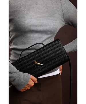 The Petal Envelope Style Woven Clutch Bag brings a chic woven texture and sleek envelope flap together in a timeless design. Made from durable faux leather, it’s compact yet practical, with enough room for your essentials. Finished with a slim handle and detachable strap, it can be styled as a clutch or worn over the shoulder—perfect for evenings out or special occasions. Key Features: • Material: Faux leather with woven finish • Dimensions: Compact envelope size • Fastening: Flap closure • Detail: Slim handle and detachable strap for versatile wear
