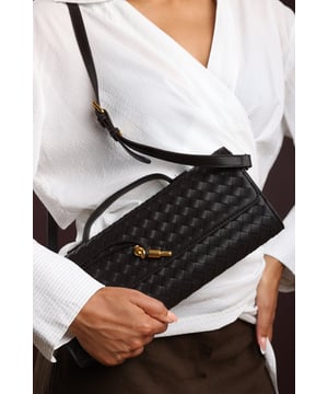The Petal Envelope Style Woven Clutch Bag brings a chic woven texture and sleek envelope flap together in a timeless design. Made from durable faux leather, it’s compact yet practical, with enough room for your essentials. Finished with a slim handle and detachable strap, it can be styled as a clutch or worn over the shoulder—perfect for evenings out or special occasions. Key Features: • Material: Faux leather with woven finish • Dimensions: Compact envelope size • Fastening: Flap closure • Detail: Slim handle and detachable strap for versatile wear
