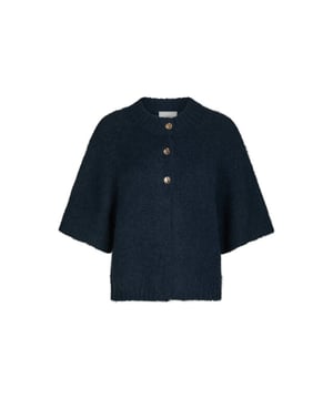
70% Polyester / 21% Nylon / 8% Wool / 1% ElastaneBoxy gebreide cardigan met wijde mouwen en leuke decoratieve knopen aan de voorkant. De kwaliteit is zacht en heeft een fluffy look. Het model is 176 cm lang en draagt ​​maat 36.