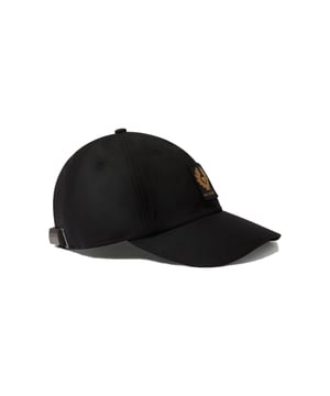 BELSTAFF PHOENIX PATCH WAXED CAP IN BLACK Step out in style and shield yourself from the harsh winter elements with the Belstaff Phoenix Patch Waxed Cap. Crafted from waxed cotton, it's designed to keep you comfortable and dry, no matter what the day brings. The iconic Belstaff Phoenix, a symbol of heritage and adventure, is embroidered on the front, adding a touch of distinction to your look. With its adjustable fit and durable build, this cap is ready to be your go-to accessory for any journey. Features Shell: 100% Cotton, Facing: 100% Polyester 6 oz. waxed cotton, with a unique blend of micro and technical waxes Soft-structured cap with adjustable fabric back strap Curved peak with multi-stitching detail Embroidered edge phoenix patch at front Water repellent Style: 105347