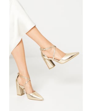 Taking you to new heights, heels can give you the confidence to feel like a brand new person. With lots of bold styles to choose from such as dazzling glitter slingbacks, feather embellished pumps, satin stilettos and cross-over platforms, our heel collection will have you planning your outfits from the feet up. Style: Treat Block Heel Cross Strap Court.  Ideal for: Occasion.  Fit: Regular.  Design: Strap Detail.