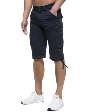Enzo Mens Cargo Combat Jeans. 7 Pocket Design Including Single Coin Pocket. 2 Front Slash Pockets with Extra Fabric Stitching Detail. 2 Side Cargo Pockets, 2 Back Bellow Pockets with Velcro Fastening Flap. Extra Stitching Details to all Pockets. Adjustable Drawstring to the Hems. Zip Fly Fastening. Premium Quality Fabric Ideal for Casual and Heavy Duty Work Wear.