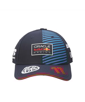 New Era Red Bull Racing Sergio Perez 9FORTY Cap in blue.- Adjustable strap at the back.- Curved brim.- New Era logo is proudly displayed on the front of the cap  highlighting the brand's iconic  timeless design.- Lightweight and breathable.- 100% Cotton.- Ref: 60504672