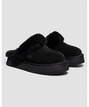 Merging the Coquette and Disco styles for a new slipper that's completely unique, the Disquette adds a retro-style platform sole to a familiar slip-on silhouette for outdoor wear, all-day cushion, and a maximalist look.
Crafted from UGG signature sheepskin and suede, this effortless style adds a playful statement to all your favourite outfits, try pairing with jeans or a flowy midi dress.