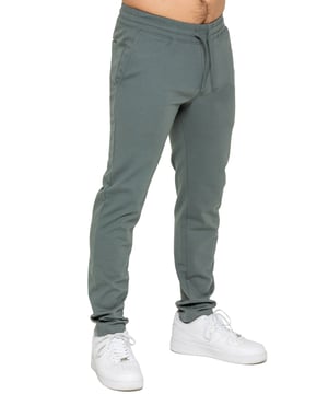 Upgrade your everyday style with the Enzo Smart Stretch Joggers, designed for both comfort and versatility. Featuring an elasticated waistband with an adjustable drawstring, these joggers ensure a secure and personalized fit. The straight-leg design offers a sleek, modern look, while the premium stretch fabric provides ultimate flexibility and all-day comfort. Functional yet stylish, they come with two side entry pockets and two back welt pockets. These joggers are the perfect blend of smart tailoring and relaxed wearability.