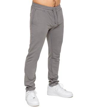 Upgrade your everyday style with the Enzo Smart Stretch Joggers, designed for both comfort and versatility. Featuring an elasticated waistband with an adjustable drawstring, these joggers ensure a secure and personalized fit. The straight-leg design offers a sleek, modern look, while the premium stretch fabric provides ultimate flexibility and all-day comfort. Functional yet stylish, they come with two side entry pockets and two back welt pockets. These joggers are the perfect blend of smart tailoring and relaxed wearability.