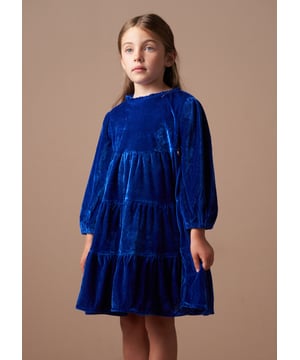 Get ready for seasonal celebrations with this rich blue velvet tiered dress. In a classic colour with a long sleeve and lots of volume through the skirt, it's stunning.