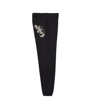 Y-3 Graphic French Terry Joggers in black. The Y-3 Graphic French Terry Pants create a harmonious balance between fashion and sport. The relaxed silhouette hangs with a casual slouch for a soft  comfortable feel. They're finished with a graphic Y-3 patch.These pants are made with natural and renewable materials.- Y-3 pants with a relaxed fit  made with nature.- Loose fit.- Braided cotton drawcord on waist with zip fly.- Top-stitch inseam pockets.- Twin-needle top stitch on sides.- Elasticated cuffs.- Y-3 graphic patch.- 100% Organic cotton.  Machine washable.- Ref: IQ2128