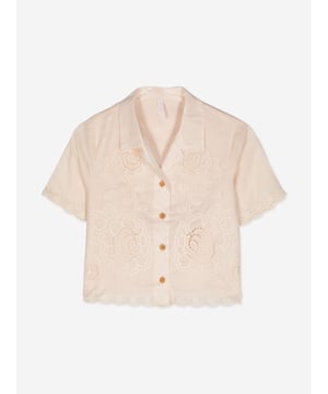 Introducing the elegant Girls Halliday Embroidered Shirt by Zimmermann in pristine Ivory, a sophisticated choice for AW2024. Immaculately designed, this piece blends luxury with whimsical charm, perfect for fashion-forward young girls. Key features include:‚ Exquisite Embroidery: Delicate threading details provide a touch of artisanal craftsmanship.‚ Premium Fabric: Finely woven for durability and softness, guaranteeing comfort and long-lasting wear.‚ Versatile Style: Ideal for both casual and formal occasions, enhancing any outfit with its refined aesthetic.Elevate her wardrobe with the Zimmermann Girls Hallailday Embroidered Shirt in Ivory. Experience unmatched quality and style. Shop now!