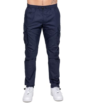 Upgrade your everyday style with the Enzo Men's Cargo Pants. Crafted from premium stretch fabric, these lightweight trousers offer a tapered leg fit for a sleek, modern look. Featuring an elasticated waistband with an adjustable toggle, they provide a customizable fit, while the adjustable toggle ankles let you tailor the look and feel. With two side slash pockets, two cargo pockets with secure Velcro fastening, and a single back welt pocket, you’ll have ample storage for essentials. Finished with an Enzo print on the cargo pocket. (649)