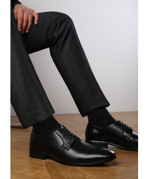 Upgrade your formal footwear with these classic derby shoes for men. Designed in high-quality faux leather, they offer a clean, sophisticated look ideal for office wear, weddings, and smart-casual occasions. With timeless appeal and modern comfort, these lace-up dress shoes are a must-have in every gentleman’s wardrobe.

Key Features:
• Durable faux leather upper with a smooth, polished finish
• Classic derby lace-up design for a versatile fit
• Cushioned insole for superior all-day comfort
• Sleek almond toe for a refined, formal silhouette
• Slip-resistant rubber sole for enhanced grip and stability