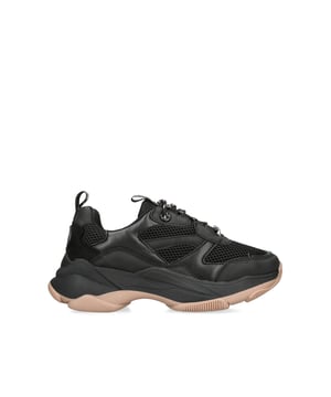 The KG Kurt Geiger Lila Lace Up sneaker features a black upper with KG Kurt Geiger branded tabs on the front and back of the shoe. The whole is chunky in black with a nude outsole.