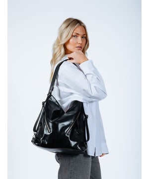 Introducing the Shoulder Bag and Backpack -2 in 1 Bag by SVNX. This versatile everyday essential seamlessly transitions between a chic shoulder bag and a practical backpack. Add a touch of metallic flair to any outfit with this must-have accessory.

Colour: Black
Material: 100% PU
Size: W - 34cm H - 36cm D - 16cm
Care: Wipe Clean Only
SKU:HB326902
