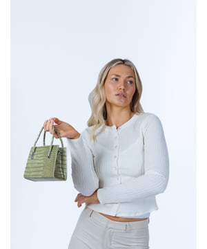 A sleek, square boxy design with two adjustable straps. Versatile and stylish, this bag can be used as a grab-and-go accessory or a chic day bag. Colour: Sage Green Size: one size. PU/Polyester. Zip Closure. Mobile phone pocket. SKU:HB350717
