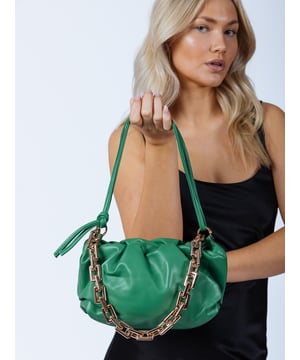 Faux Leather Pouch Clutch Bag in Green. Featuring 2 optional straps, one chunky chain strap and a matching green strap in matte PU finish. This versatile piece can be styled as a clutch or worn as a shoulder bag, making it perfect for any occasion. 
H:14cm W:24cm D:10cm SKU:HB342217