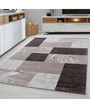 
Prachtig design vloerkleed uit de Parma Collectie. - 160x230 CM Prachtig design vloerkleed uit de Parma Collectie. Dit vloerkleed geeft een verfrissende look vanwege zijn moderne motief. Met een poolhoogte van 10mm is dit vloerkleed superwarm en geschikt voor vloerverwarming. De vlakken zijn ingeschoren en geven een mooi 3D effect. Dit vloerkleed is super vol geweven met 272.000 pooldraden/m². Dit vloerkleed is anti-statisch en anti-allergisch. Gemakkelijk in onderhoud en zeer gemakkelijk te stofzuigen. Dit model beschikt over meerdere contrasterende kleuren en geeft een mooie sfeer in elk interieur. Artikeldetails: 272.000 pooldraden/m² Gewicht 1,9 kg/m² Materiaal onderkant: Jute Materiaalsamenstelling 100% polypropyleen Frisee Poolhoogte 13 mm Productietechniek: Machinaal geweven Loopgeluiddempend Merk: Muratap Materiaal: Polypropyleen Kleur: Bruin Afmetingen: 160x230 CM EAN: 7444708014038