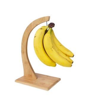 
Houd fruit langer vers Wist je dat het aanraken van een banaan al voor een beurs plekje zorgt? Rotte plekken lijken bijna onvermijdelijk. Bijna. De bananenhouder is dé oplossing. Het houten standaard bewaart bananen in hun natuurlijke houding,alsof ze nog aan de boom hangen. Hang ook andere trosproducten aan de haak. De houder is te gebruiken als ondersteuning van druiven,tomaten,pepers,knoflook ... Het zijn producten die met zachte hand dienen behandeld te worden. De geringste onvoorzichtigheid en er verschijnen bruine plekken op de schil. De houten bananenhouder geeft de gevoelige vruchten een eigen plek,waar ze verder kunnen rijpen.  Elegant, mooi en stabiel De voet is met 18 x 13 x 32 cm (lxb) van ideale grootte. Hij houdt de standaard stabiel,ook al sla je een grotere tros aan de haak. Met die tros mag je gerust pronken. Fruit in de keuken is niet alleen mooi ter decoratie,maar uiteraard ook gezond. Bananen zijn een verantwoord en lekker tussendoortje. Ze geven je een flinke energieboost en zorgen ervoor dat je lichaam het beste haalt uit andere vruchten. Ze zijn een magneet voor gezonde voedingsstoffen. Als je die heerlijke bananen aan de houten bananenhouder ziet hangen,wil je er toch gewoon van smullen,niet? Verwijdert van het andere fruit,blijven bananen langer vers. Ze zijn gevoelig voor het geurloze en onzichtbare gas ethyleen dat vruchten afscheiden wanneer ze rijp worden. Het brengt het rijpingsproces van bananen in een stroomversnelling. Helaas zijn te rijpe bananen enkel lekker in de milkshake of gebakken in de pan.  De houten bananenhouder is goed voor je portemonnee De houder zelf kan tegen een stootje. Hij is gemaakt van robuust bamboe. Het geeft de houder een warme uitstraling waardoor hij in elke keuken past. Op de vraag waarom bananen krom zijn,is moeilijk een antwoord te geven. Deze houten standaard biedt wel een antwoord op jouw bewaarwensen. Leg trosproducten niet langer in de fruitschaal,maar laat ze gelijkmatig rijpen aan de haak. Je kan langer genieten van je aangekochte groenten en fruit: Goed voor je portemonnee. Door de vruchten doordachter te bewaren,moet je minder snel zinloos weggooien. Investeer daarom in deze 32 cm hoge hanger,en pluk er de vruchten van!Materiaal: HoutKleur: BruinAfmetingen: Hoogte: 32CM x breedte: 13CM x Lengte: 18CM
