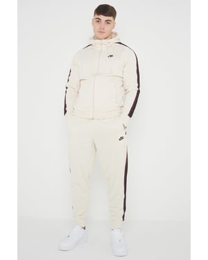 Nike Tribute poly trainingspak voor heren in crème