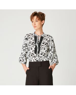 Tulpen mouwen blouse met monochrome bloemenprint en contrasterende halslijn