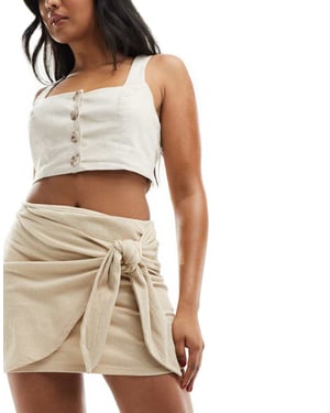 ASOS DESIGN textured tie front mini skirt in stone-Neutral