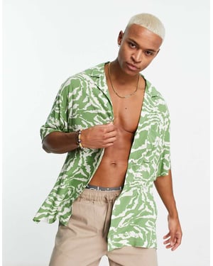 ASOS DESIGN boxy oversized revere longline bowling shirt in sage green zebra print
