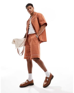 ASOS DESIGN Co-ord woven shorts with piping in brown