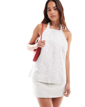ASOS DESIGN denim backless halter top in snake print