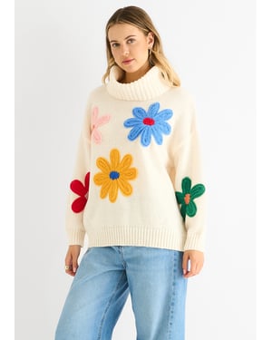 Krämfärgad överdimensionerad tröja med blommiga applikationer