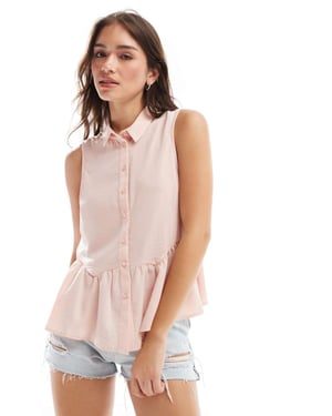 ASOS DESIGN sleeveless peplum shirt in pink
