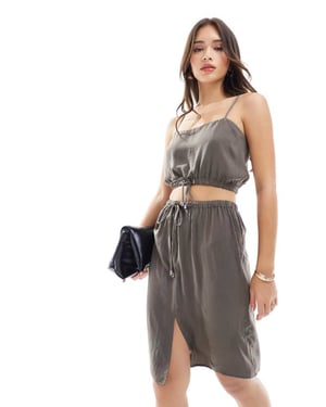 ASOS DESIGN satin tie waist premium 90's length skirt co-ord in dark green