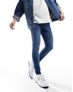 Jack & Jones – Mike – Mellanblå avsmalnande jeans