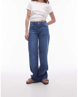 Topshop – Ember – Mörkblå jeans med låg midja och vida ben