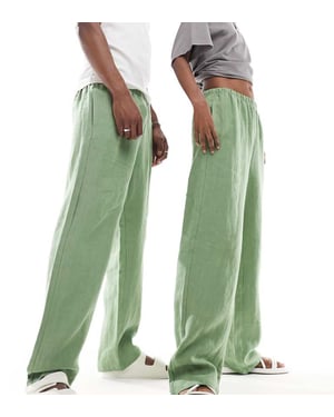 Weekday Unisex Seth linnebyxor i grönt, exklusivt hos ASOS