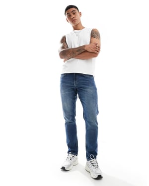 ASOS DESIGN – Blå slim fit-jeans med mellanblå tvätt