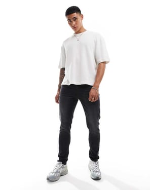ASOS DESIGN – Svarta skinny jeans med tvätt
