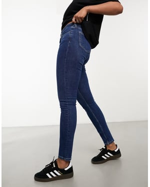 Weekday Spare – Blå skinny jeans med medelhög midja