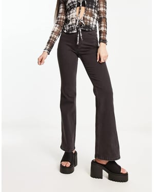 Weekday Glow – Svarta, utsvängda stretchjeans med hög midja och lyxiga mönster