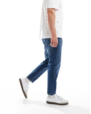 ASOS DESIGN – Blå jeans med avsmalnande passform och paneldetaljer