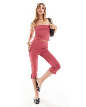 ASOS DESIGN mid rise capri leggings in burgundy