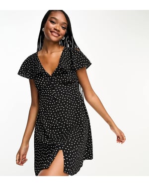 ASOS DESIGN Lång kjol med fjäderärmar och knoppar i monokrom prick.
