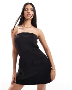 In The Style bandeau med fickdetalj strukturerad miniklänning i svart