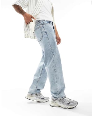 ASOS DESIGN baggy jeans med kraftig syra-tvätt i ljusblå tvätt