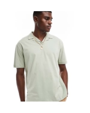 ASOS DESIGN oversized polo med ryggtryck i ljusgrön