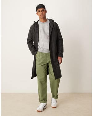 ASOS DESIGN långärmad gummibelagd vindjacka i svart