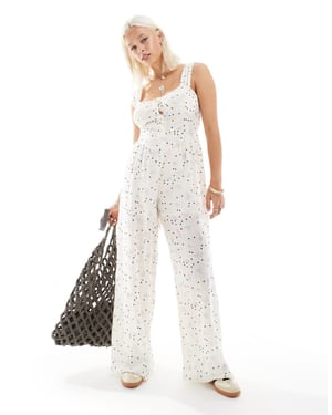 Återvunnen vintage jumpsuit med knappar i pricken-blommigt mönster