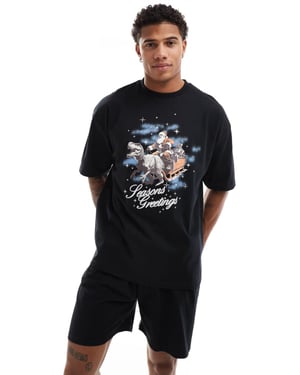 ASOS DESIGN pyjamapaket med jul-dinosaurie-slädförprint i svart