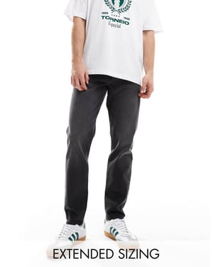 ASOS DESIGN tapered jeans i tvättad svart med toning