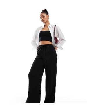 ASOS DESIGN Lång satinkjol i svart